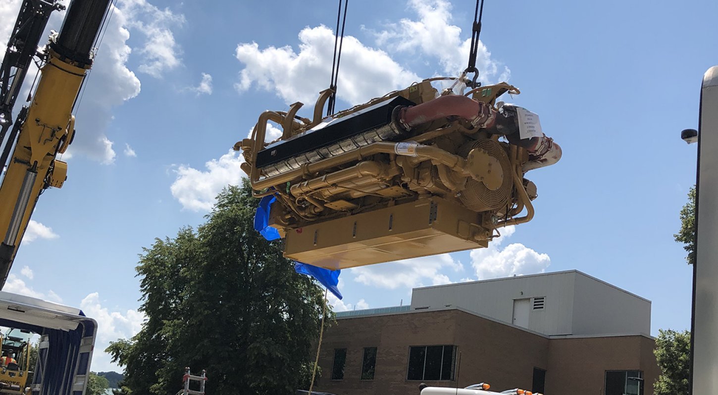Cat Engine Being Lifted into Blue Sky