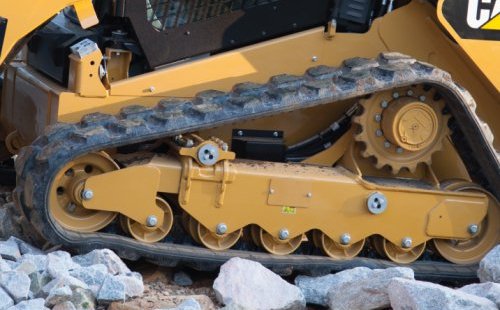 Cat Rubber Tracks on Large Rocks