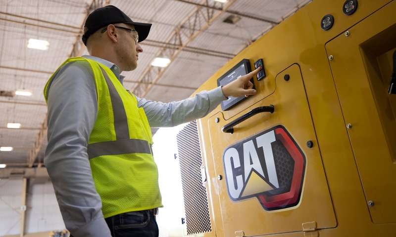Man Maintenancing Cat Generator